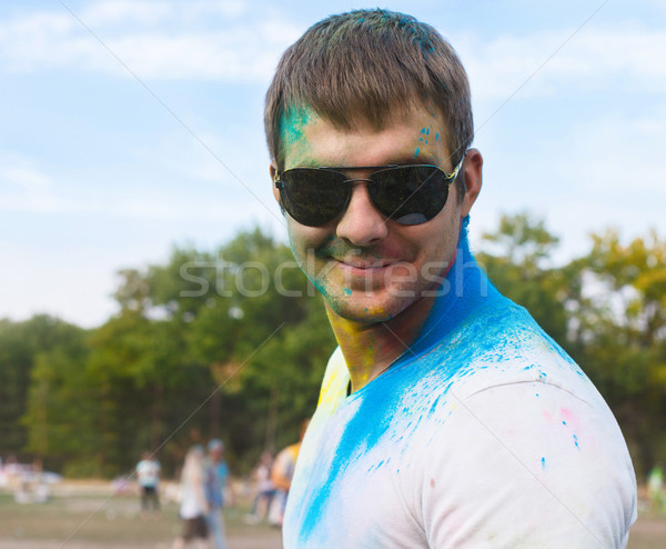 Happy young man on holi color festival Stock photo © dashapetrenko