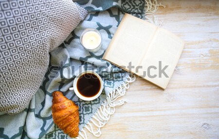 Cup of coffee, candle and book on the floor Stock photo © dashapetrenko
