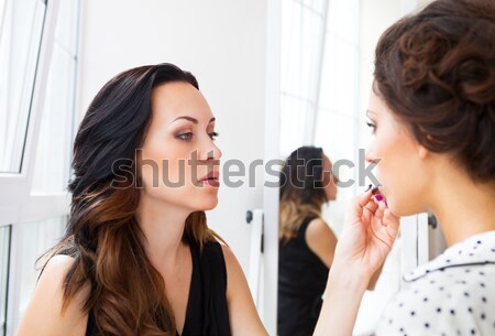 Stock photo: Stylist makes make up for bride on the wedding day