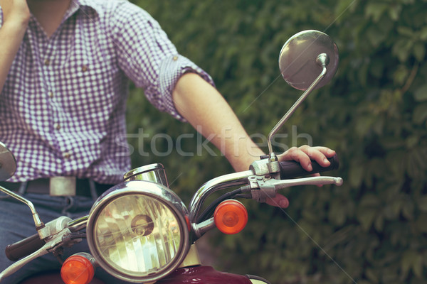 Young man riding old retro scooter Stock photo © dashapetrenko