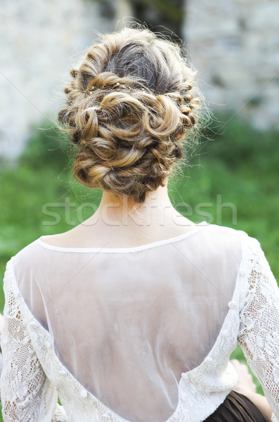 Back view of unrecognizable young woman with blond hair in white Stock photo © dashapetrenko