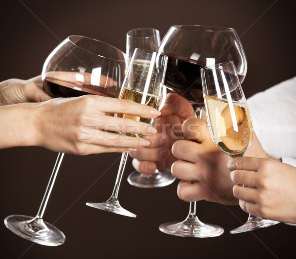 People holding glasses of white wine making a toast Stock photo © dashapetrenko