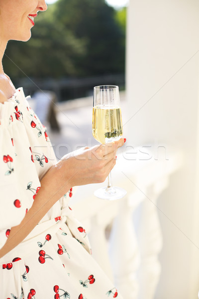 Woman holding glass of champagne. Party with sparkling champagne Stock photo © dashapetrenko