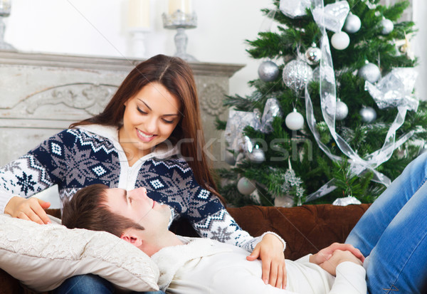 Jeunes heureux couple canapé arbre séance [[stock_photo]] © dashapetrenko