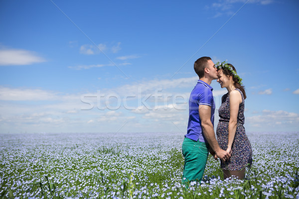 Portrait of a young beautiful pregnant couple in linen field Stock photo © dashapetrenko