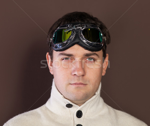 Young man wearing old-fashioned pilot glasses Stock photo © dashapetrenko