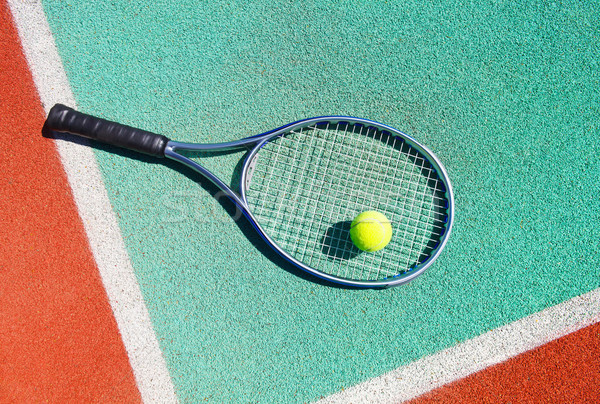 Close up of tennis racquet and ball on the tennis court Stock photo © dashapetrenko
