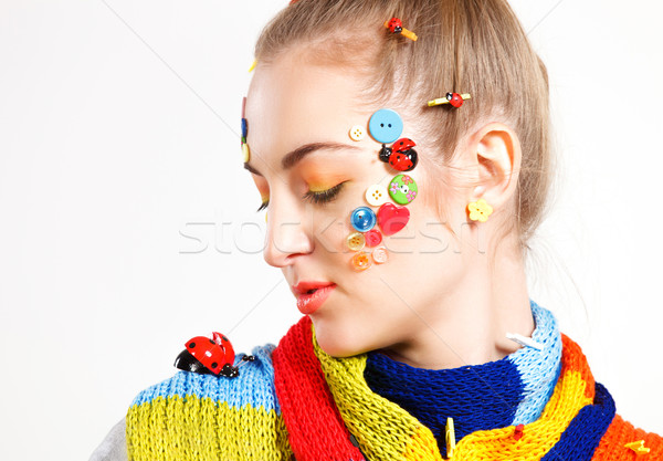 Young blond woman with creativity hairstyle with colored buttons Stock photo © dashapetrenko
