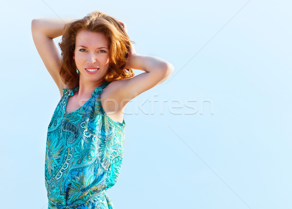 Portrait of the beautiful young woman with fluttering red hair  Stock photo © dashapetrenko