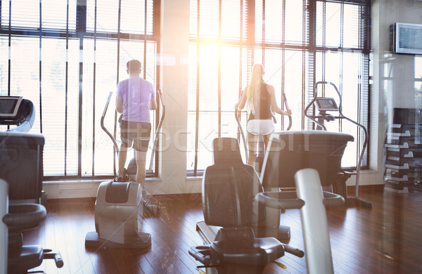 Couple training on a treadmill in a sport centre Stock photo © dashapetrenko