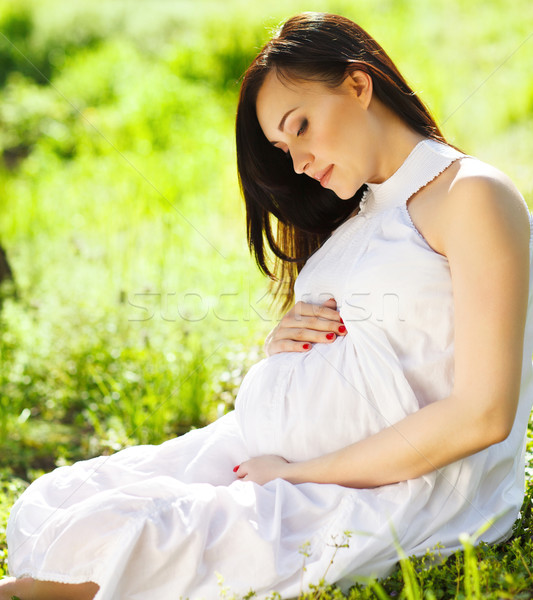 Stock photo: Portrait of beautiful pregnant woman in the spring park