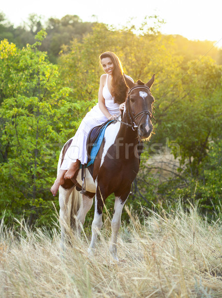 Young woman riding a horse  Stock photo © dashapetrenko