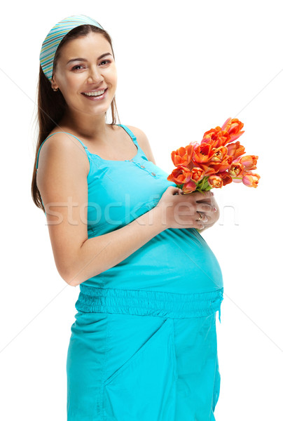 Stock photo: Happy young pregnant woman in blue 