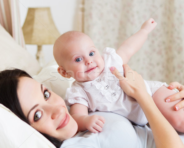 Happy smiling mother with six month old baby girl  Stock photo © dashapetrenko