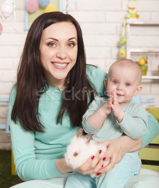 Stock photo: Mother and baby girl holding Easter rabbit 