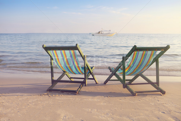 Two empty sun chairs on the beach  Stock photo © dashapetrenko