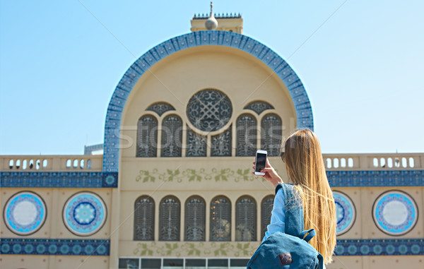 Woman taking mobile photo of the Central Souq in Sharjah City, U Stock photo © dashapetrenko