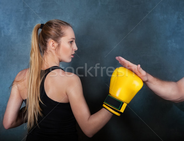 Female boxer practicing in the boxing ring Stock photo © dashapetrenko