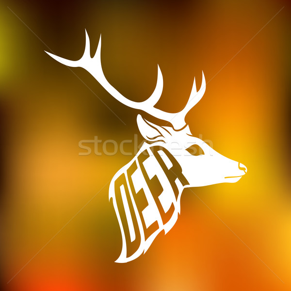 Stock photo: Concept silhouette of deer head with text inside be free on blur background.