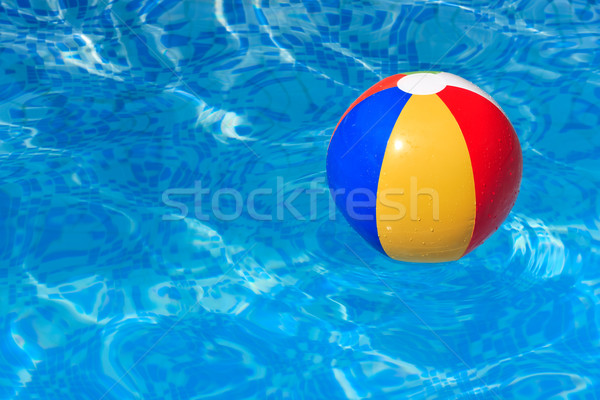 A colorful beach ball floating in a swimming pool Stock photo © david010167