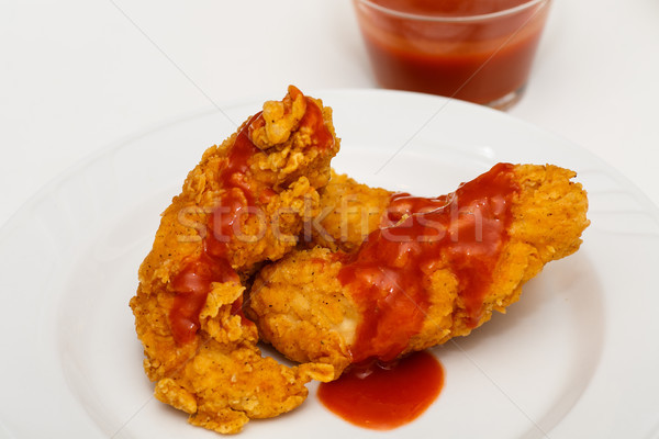 Kurczaka skrzydła hot sauce biały tablicy Zdjęcia stock © dbvirago