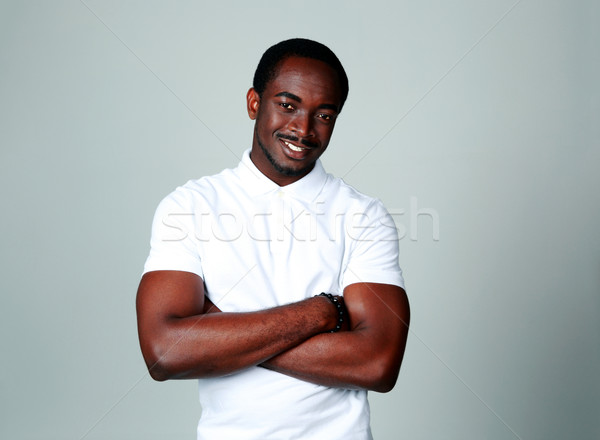 Portret vrolijk afrikaanse man grijs handen Stockfoto © deandrobot