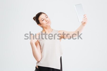 Businessman in suit hanging himself on tie over white background Stock photo © deandrobot