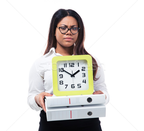 African businesswoman holding folders and clock Stock photo © deandrobot