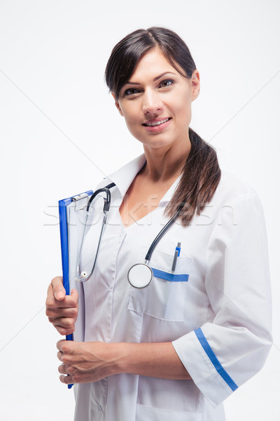 Smiling medical doctor with clipboard Stock photo © deandrobot