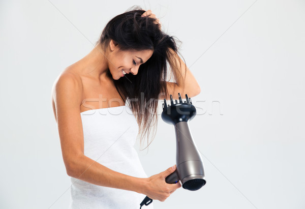 Happy woman in towel drying her hair Stock photo © deandrobot