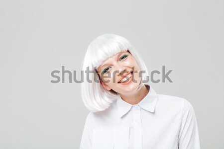 Portrait of cheerful lovely young woman with blonde hair Stock photo © deandrobot