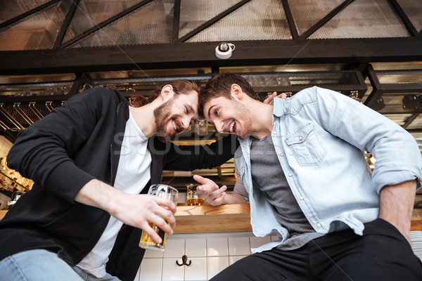Kilátás alatt részeg barátok bár ül Stock fotó © deandrobot