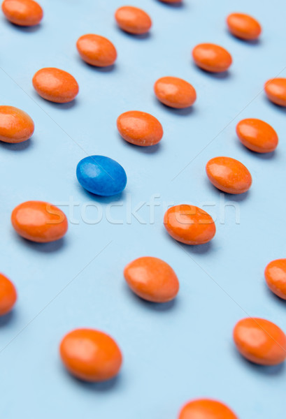 Colorful sweeties candy over blue table background. Stock photo © deandrobot