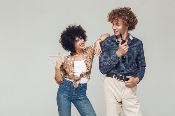 Emotional retro loving couple standing and posing Stock photo © deandrobot