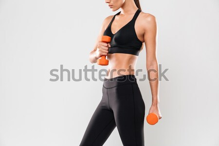 Cropped photo of amazing young sports lady make exercises Stock photo © deandrobot