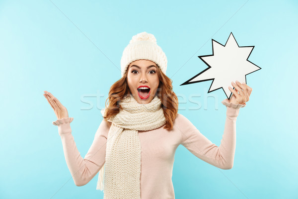 Portrait of an excited pretty girl dressed in winter clothes Stock photo © deandrobot