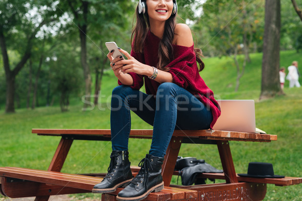 Cropped image of a smiling cheerful asian girl Stock photo © deandrobot