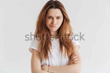Niezadowolony kobieta tshirt broni patrząc kamery Zdjęcia stock © deandrobot
