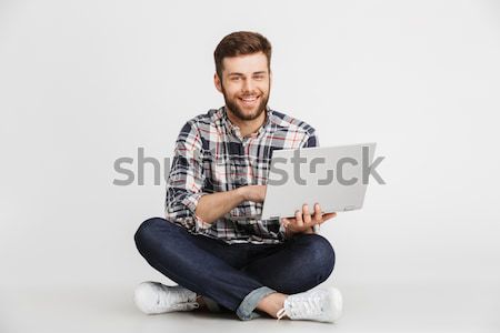 Portrait of a charming young man Stock photo © deandrobot