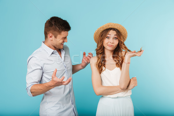 Angry caucasian loving couple friends quarrel. Stock photo © deandrobot