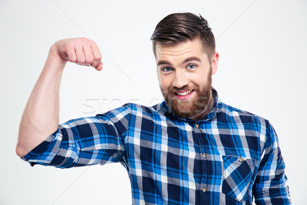 Portrait of a handsome man showing his muscles  Stock photo © deandrobot