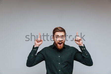 Funny businessman holding his ears Stock photo © deandrobot