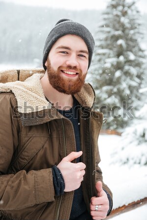 [[stock_photo]]: Souriant · homme · permanent · montagne · hiver · forêt