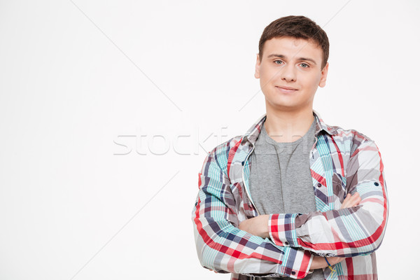 Man standing with arm folded and looking at camera  Stock photo © deandrobot
