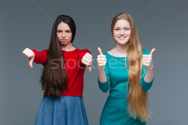 Two women over gray Stock photo © deandrobot
