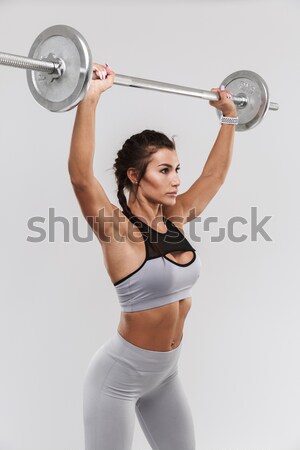 Pretty fitness girl with barbell Stock photo © deandrobot
