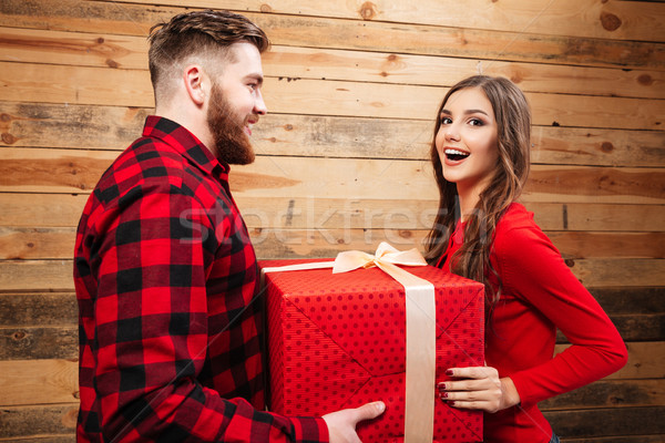 Man gives beauty woman gift Stock photo © deandrobot