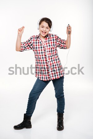 Függőleges kép lány póló hallgat zene Stock fotó © deandrobot