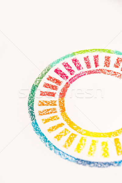 Cropped photo of circle drawn with colorful pastel chalks Stock photo © deandrobot