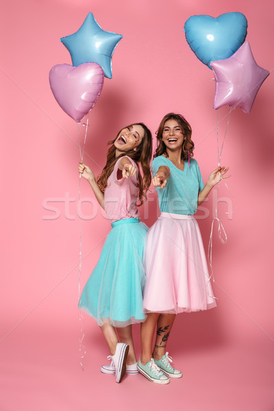 Two cheerful young girls Stock photo © deandrobot